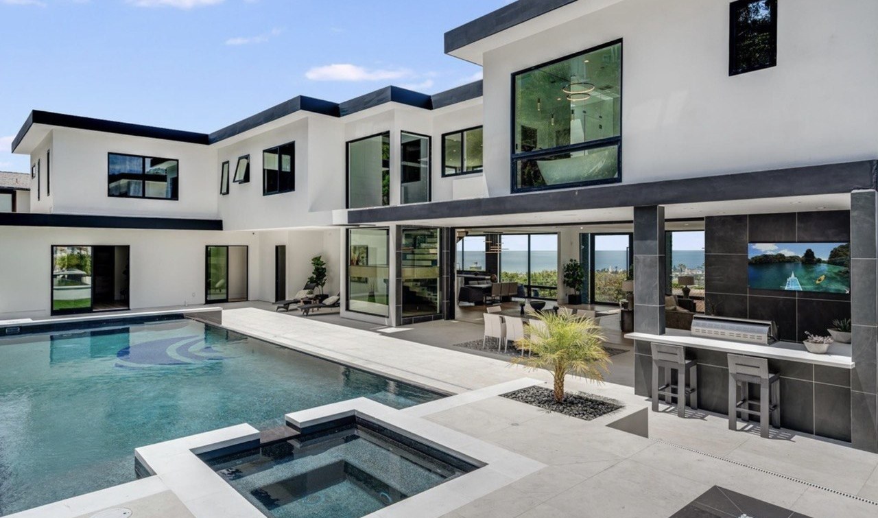 https://ansconstruction.us/wp-content/uploads/2026/10/courtyard-pool-outdoor-kitchen.jpg