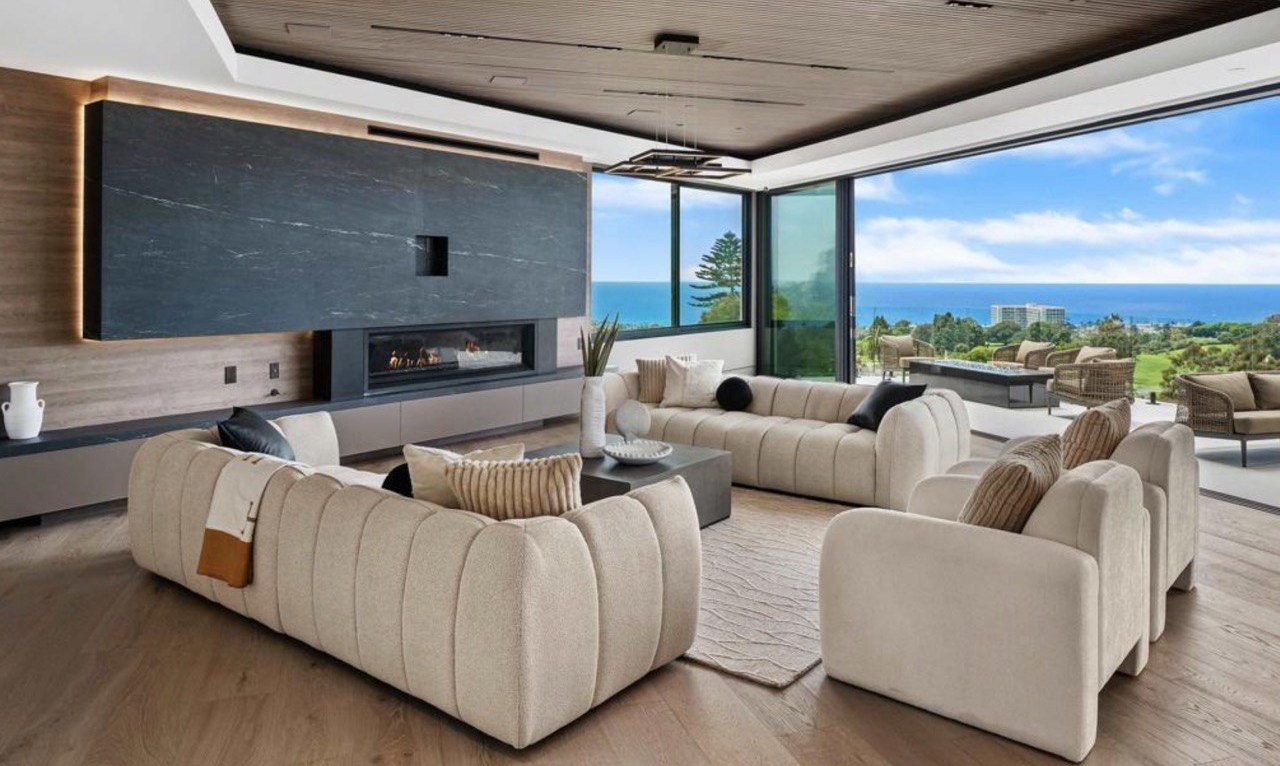 https://ansconstruction.us/wp-content/uploads/2026/10/living-room-fireplace-ocean.jpg